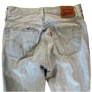 Levi's 501 Light Blue Denim Jeans. Button fly. Rips. Size 27. Leg 28. Like new